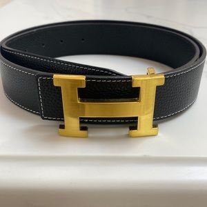 Black leather Hermes belt with gold emblem